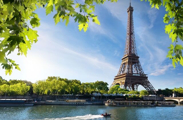 a tower with boats in the water having the best Tourist Attractions