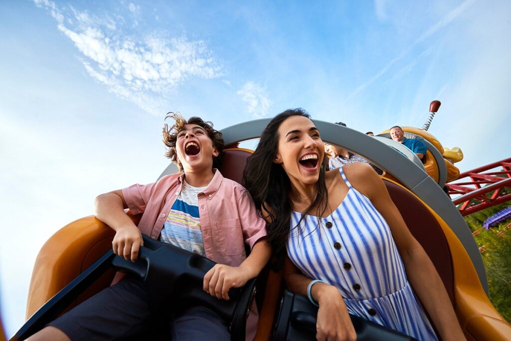 a couple of people on a roller coaster in Orlando