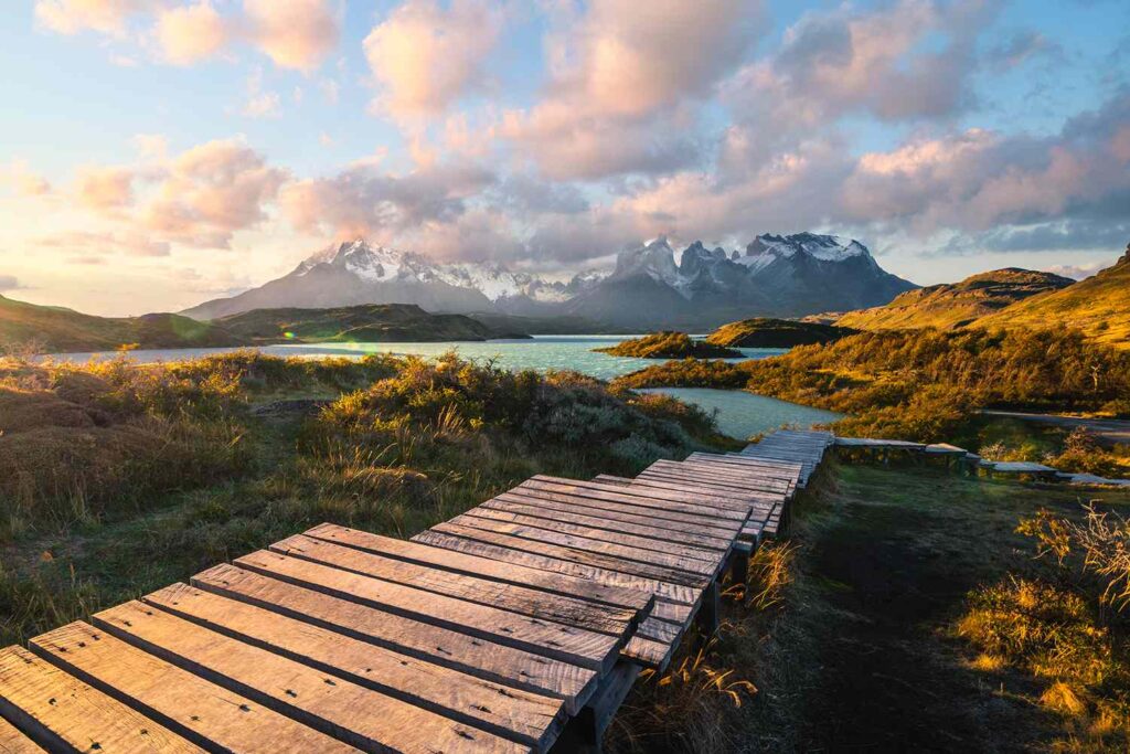 a wooden walkway leading to a lake
in Urban Escape.